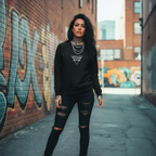 A model be wearin' a black oversized crewneck with bold 'Psycho B*tch' text, set in a graffiti-filled alley.