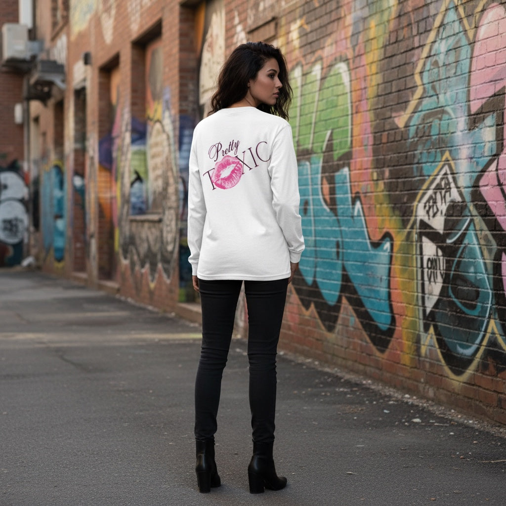 A white oversized long sleeve shirt with bold front and back graphics, styled with black pants in an urban setting.