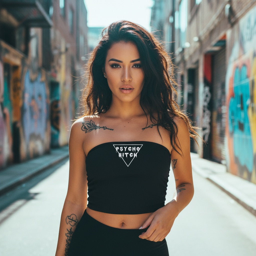 Black cropped tube top with 'PSYCHO B*TCH' text, worn by a model in an urban setting.