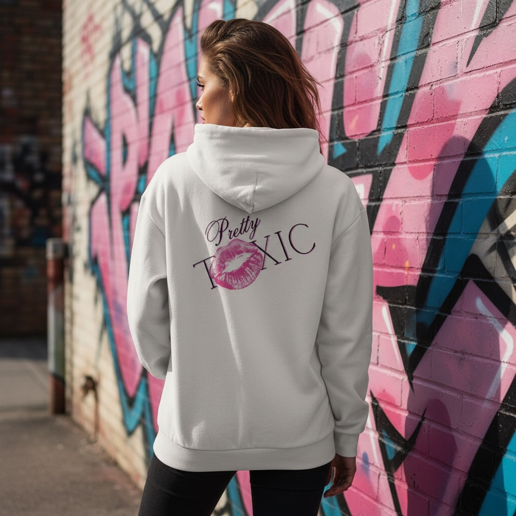 Pretty Toxic Signature Hoodie worn by a model in an urban setting, featuring a large back graphic and kiss mark.