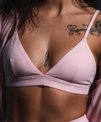 Pretty Toxic Cropped V-Neck Sports Bra in pink — front view